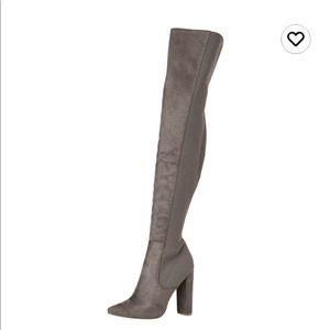 Gray Steve Madden boots with 4” heel.